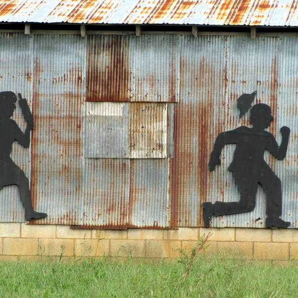 funny married couple fighting rolling pin