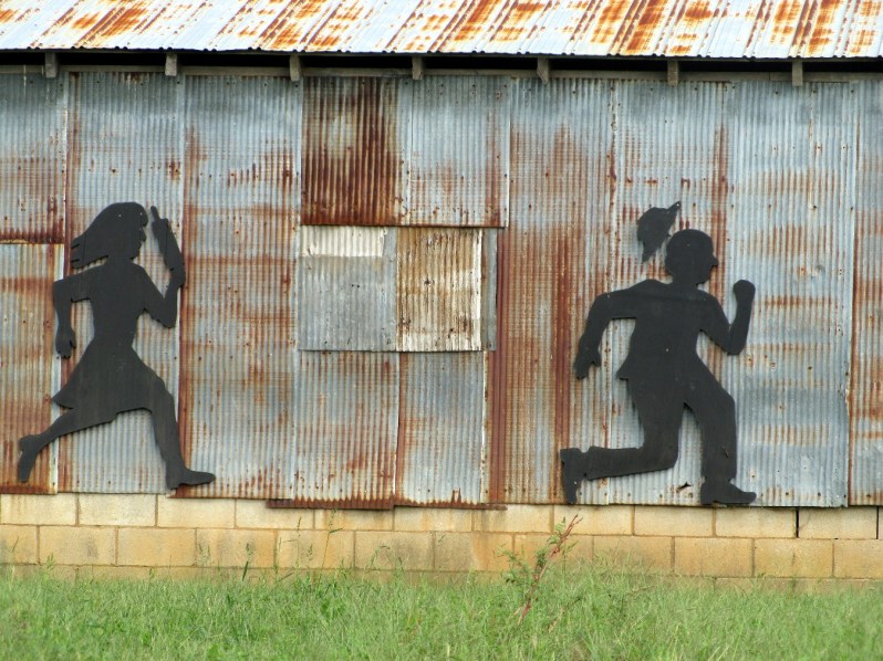 funny married couple fighting rolling pin